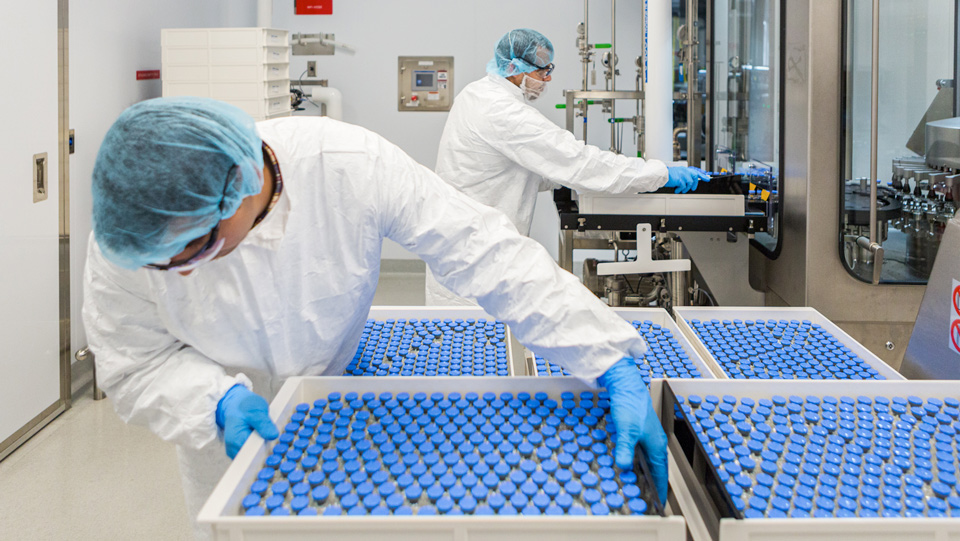Unloading filled vials of investigational remdesivir credit gilead