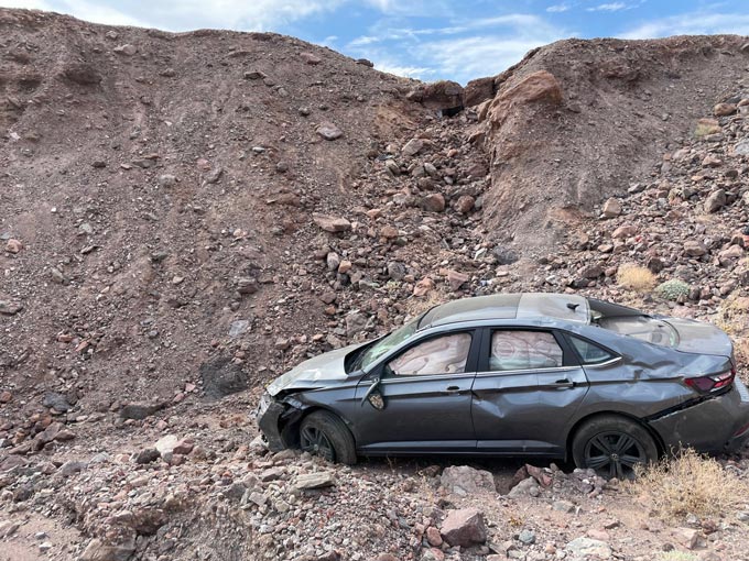 Natural Bridge vehicle below embankment death valley np