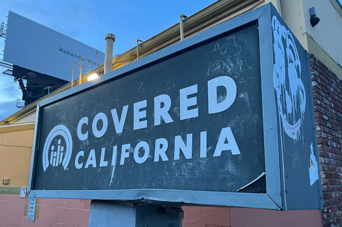 KFF729 covered California sign Gabe Brison Trezise KFF Health News